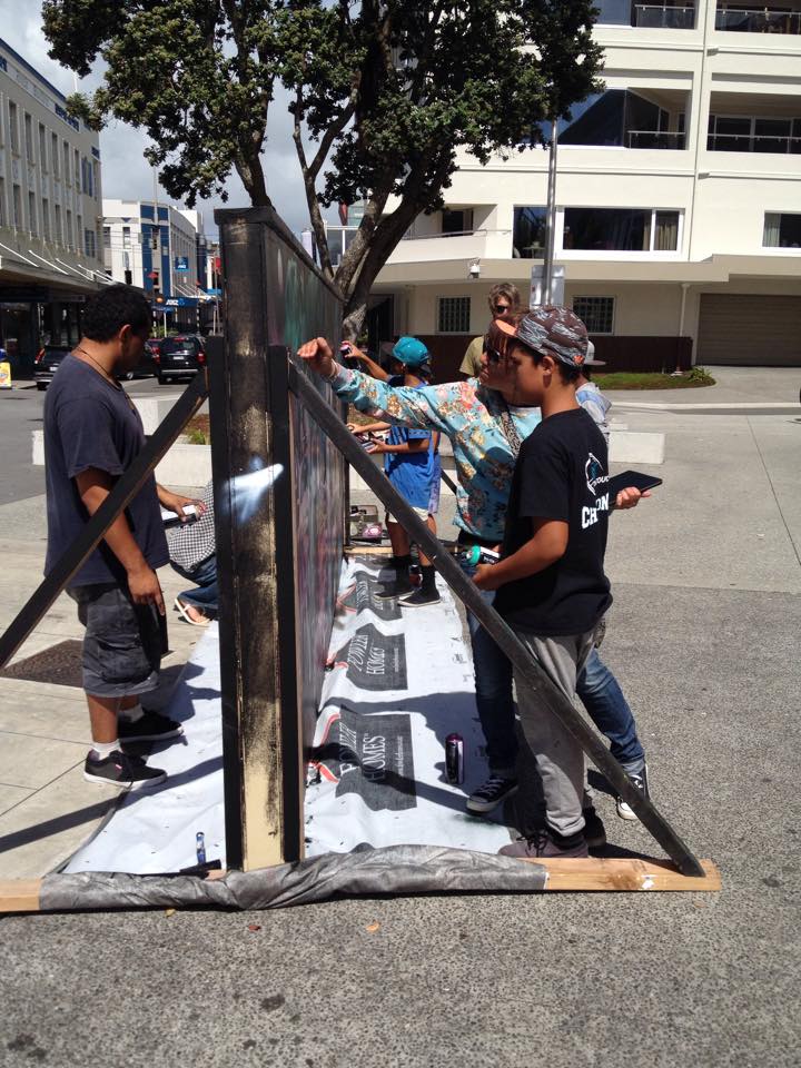 Artist working on street art